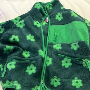 Green, warm jacket with flowers on them. Many pockets super cute.